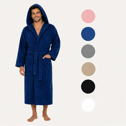 A man wearing a plush hooded bathrobe in dark blue, shown against a light gray background with vertical color swatches on the right side. The robe has a tie belt and front patch pocket.