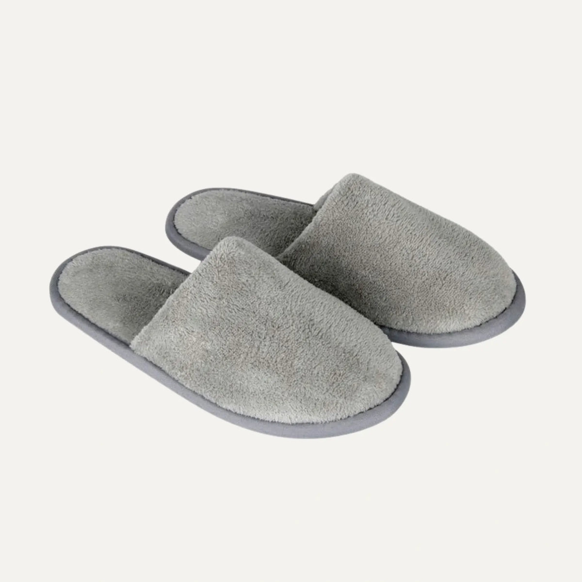 A pair of plush, open-toe slip-on slippers in a heather gray color, shown on a light off-white background.