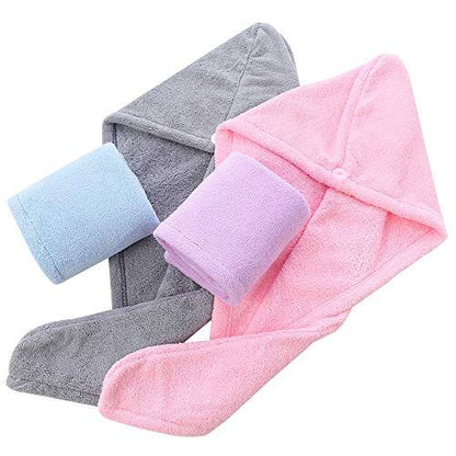 Three hooded towels in pink, gray, and blue on a white background